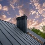 Modern metal chimney on the roof for ventilation