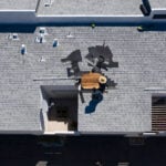 Roof Repair Inspection In Progress Aerial Above Head Condo Building Gray Shingles 2 Roofers