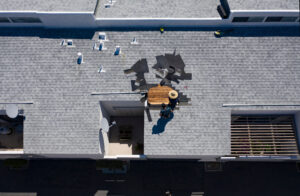 Roof Repair Inspection In Progress Aerial Above Head Condo Building Gray Shingles 2 Roofers