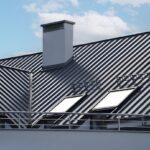 Close-up house retro roof panel with standing seam and fasteners. Classic style black metal panel with rebate joint. Modern galvanized steel roofing sheet with ribs.