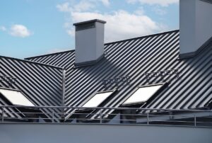 Close-up house retro roof panel with standing seam and fasteners. Classic style black metal panel with rebate joint. Modern galvanized steel roofing sheet with ribs.