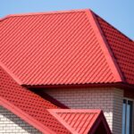 roof with a window in a brick house .