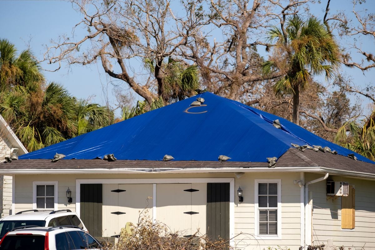 emergency roof tarping after storm roof damage small house